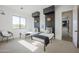 Bright, airy bedroom with twin beds, woven pendants, and an inviting reading nook at 3015 W Irvine Rd, Phoenix, AZ 85086