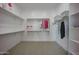 Spacious walk-in closet with ample shelving and hanging space at 3015 W Irvine Rd, Phoenix, AZ 85086
