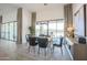 Bright dining room with elegant table, chairs, decorative curtains, and view to the outdoor space at 3015 W Irvine Rd, Phoenix, AZ 85086