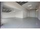 Expansive garage with epoxy flooring, overhead lighting, and multiple access doors, suitable for various needs at 3015 W Irvine Rd, Phoenix, AZ 85086