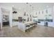 Modern kitchen featuring a large center island with bar seating and sleek, white cabinetry at 3015 W Irvine Rd, Phoenix, AZ 85086