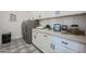 Well-organized laundry room with modern appliances and ample storage space at 3015 W Irvine Rd, Phoenix, AZ 85086