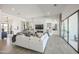 Bright, open living room with a stone fireplace and sliding doors leading to the outside at 3015 W Irvine Rd, Phoenix, AZ 85086