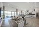 Expansive living room with open floor plan, modern furnishings, and outdoor access at 3015 W Irvine Rd, Phoenix, AZ 85086