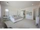 Spacious primary bedroom featuring neutral tones, bright lighting, and ensuite bath access at 3015 W Irvine Rd, Phoenix, AZ 85086