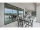 Covered patio seating area with sliding glass doors and serene outdoor views for relaxing and entertaining at 3015 W Irvine Rd, Phoenix, AZ 85086