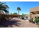 Landscaped backyard has a pool and comfortable seating, creating a perfect outdoor living space to enjoy the desert climate at 4152 N Signal Cir, Mesa, AZ 85215