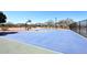 Community basketball court featuring a blue surface with green accents and black fencing at 4152 N Signal Cir, Mesa, AZ 85215