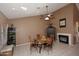 Dining area with a fireplace, tile flooring, and plenty of space for entertaining at 4152 N Signal Cir, Mesa, AZ 85215