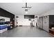 Spacious garage featuring storage cabinets, epoxy floors, and a garage door opener at 4152 N Signal Cir, Mesa, AZ 85215