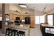 Open kitchen featuring granite countertops, modern appliances, and breakfast bar seating at 4152 N Signal Cir, Mesa, AZ 85215