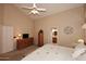 Cozy main bedroom with plush carpet, ensuite bathroom, and a walk-in closet at 4152 N Signal Cir, Mesa, AZ 85215