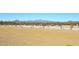 Paved walking path winds through desert landscape; mountains in the background at 4152 N Signal Cir, Mesa, AZ 85215