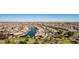 Picturesque community featuring beautiful homes nestled around a tranquil water feature and lush landscaping at 41960 W Ellington Ln, Maricopa, AZ 85138