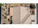 A bird's eye view shows the backyard patio with shade umbrella and roof of a desert property at 41960 W Ellington Ln, Maricopa, AZ 85138