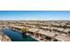 Aerial view shows a desert neighborhood with lakes, desert landscaping, and well-maintained homes at 41960 W Ellington Ln, Maricopa, AZ 85138
