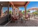 Inviting covered patio with comfortable seating area and views of the lake at 41960 W Ellington Ln, Maricopa, AZ 85138