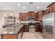 Kitchen featuring granite countertops, stainless steel appliances, and lots of cabinet space at 41960 W Ellington Ln, Maricopa, AZ 85138