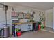 Well-organized garage featuring a workbench, pegboard, and ample storage for tools and projects at 4708 E Euclid Ave, Phoenix, AZ 85044