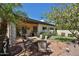 Outdoor patio with stone flooring, dining set, bar counter, and lush landscaping creates a perfect spot for gatherings at 4708 E Euclid Ave, Phoenix, AZ 85044