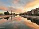 Picturesque waterfront scenery with mirrored reflections on the water during a colorful sunset at 4810 N 74Th Pl, Scottsdale, AZ 85251