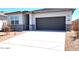 Charming single-story home with neutral stucco, stone accents, and a two-car garage at 4927 S 106Th Ave, Tolleson, AZ 85353