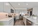 Modern kitchen is equipped with stainless steel appliances, granite countertops, and under cabinet lighting at 4927 S 106Th Ave, Tolleson, AZ 85353