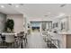 Open-concept living and dining area with abundant natural light and seamless access to the backyard at 4927 S 106Th Ave, Tolleson, AZ 85353