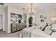 This main bedroom features a large, comfortable bed, decorative lighting, and modern décor at 4927 S 106Th Ave, Tolleson, AZ 85353