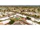 Expansive aerial view of a vibrant residential community with lush landscaping and sparkling pool, offering a serene neighborhood setting at 5032 N 78Th St, Scottsdale, AZ 85250
