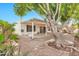 The private backyard has a covered patio and mature trees at 5032 N 78Th St, Scottsdale, AZ 85250