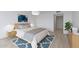 Cozy bedroom with a blue rug, light wood furniture, and a serene atmosphere at 5032 N 78Th St, Scottsdale, AZ 85250