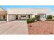 A cozy single-story house featuring an attached carport, desert landscaping, and a covered front entryway at 5032 N 78Th St, Scottsdale, AZ 85250