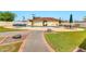 The community pool is surrounded by grass and patio furniture at 5032 N 78Th St, Scottsdale, AZ 85250