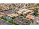 Aerial view of a community center with parking, ponds, and recreational facilities surrounded by residential homes at 540 Leisure World --, Mesa, AZ 85206
