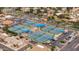 Aerial view of multiple tennis courts with blue canopies near parking and residential housing in a planned community at 540 Leisure World --, Mesa, AZ 85206