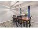 Dining room featuring hardwood table, six chairs, stylish chandelier, rug, and natural light at 540 Leisure World --, Mesa, AZ 85206