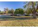Beautiful home with mature trees, green lawn, and manicured landscaping at 540 Leisure World --, Mesa, AZ 85206