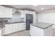 Modern kitchen featuring white cabinets, stainless steel appliances, subway tile backsplash, and gray countertops at 540 Leisure World --, Mesa, AZ 85206