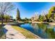 Scenic view of a tranquil pond with a walking path at 540 Leisure World --, Mesa, AZ 85206