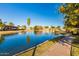 Scenic view of community pond surrounded by houses, trees, and green space at 540 Leisure World --, Mesa, AZ 85206