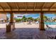 A covered view of a sunny pool area with lounge chairs and umbrellas, perfect for relaxation and leisure at 540 Leisure World --, Mesa, AZ 85206