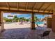 A covered view of a sunny pool area with lounge chairs and umbrellas, perfect for relaxation and leisure at 540 Leisure World --, Mesa, AZ 85206