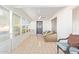 Enclosed sunroom with neutral tiling and wicker seating at 540 Leisure World --, Mesa, AZ 85206
