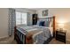 Comfortable bedroom with a window, bed, and wooden accents, providing a cozy and inviting atmosphere at 5757 W Eugie Ave # 2081, Glendale, AZ 85304