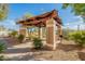 Community outdoor grill and picnic area featuring covered seating and lush landscaping at 5757 W Eugie Ave # 2081, Glendale, AZ 85304