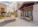 Community outdoor patio area with grill, seating, and well-maintained landscaping at 5757 W Eugie Ave # 2081, Glendale, AZ 85304