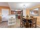 Inviting eat-in kitchen with stainless steel appliances and wooden dining set at 5757 W Eugie Ave # 2081, Glendale, AZ 85304