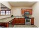 Community kitchenette featuring stainless steel appliances, granite countertops, and ample cabinet space at 5757 W Eugie Ave # 2081, Glendale, AZ 85304
