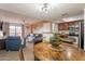 Bright open concept living room and kitchen features lots of natural light and comfortable seating at 5757 W Eugie Ave # 2081, Glendale, AZ 85304